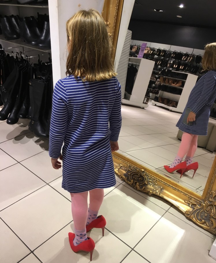 trying on the heels age 5